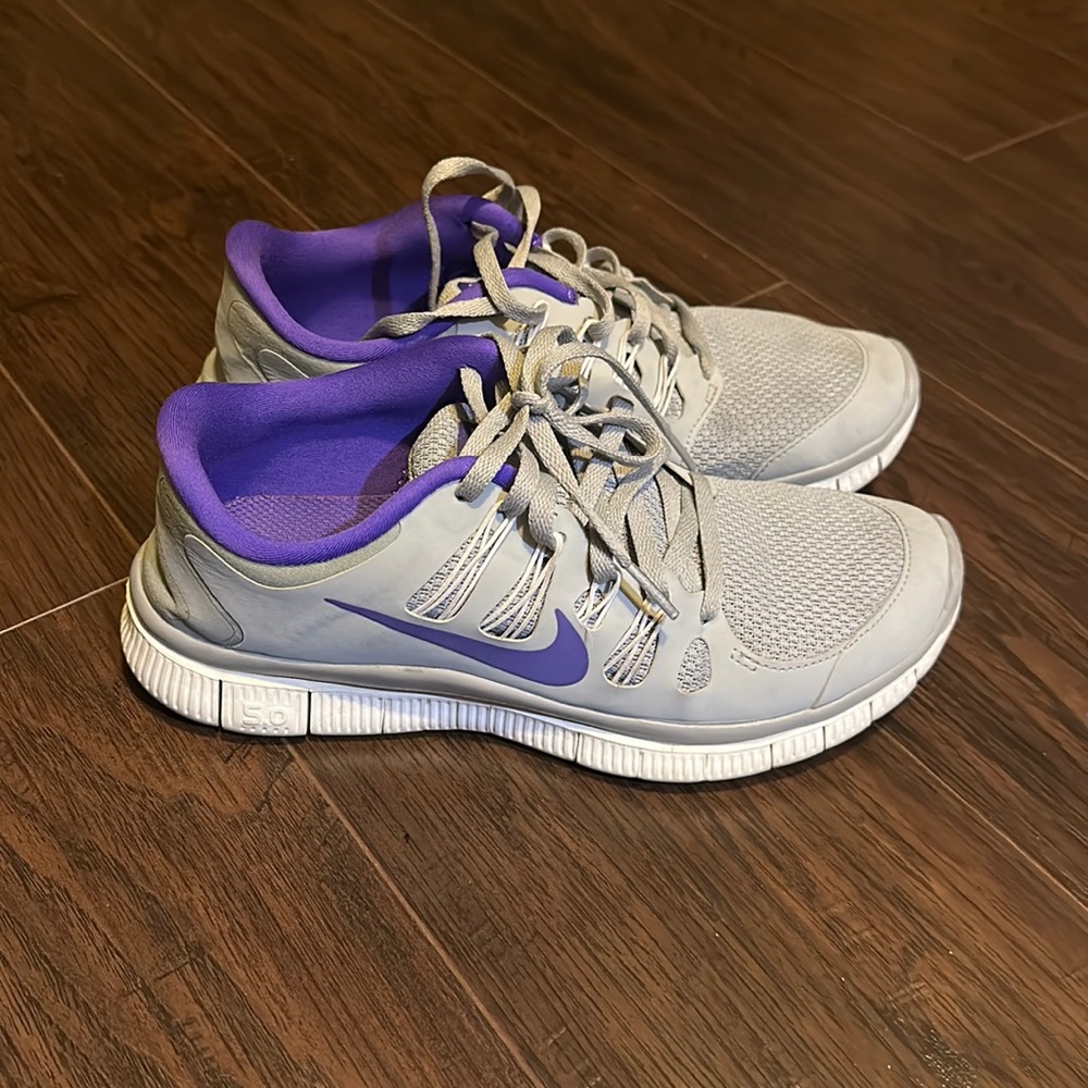 Grey & purple Nike tennis shoes. Size 8. Used but good condition
